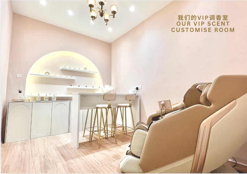 The SMOVF VIP scent customise room: a pale blush studio with a blending counter, stools and a massage chair